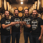Four men in a barrel room wearing 'Beards & Bourbon Club' shirts, holding glasses of whiskey.