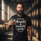 Man wearing a 'Beards & Bourbon Club' t-shirt holding a glass of whiskey in a barrel room.