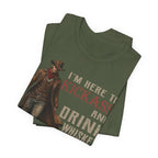 Folded green t-shirt with cowboy graphic and text on a white background