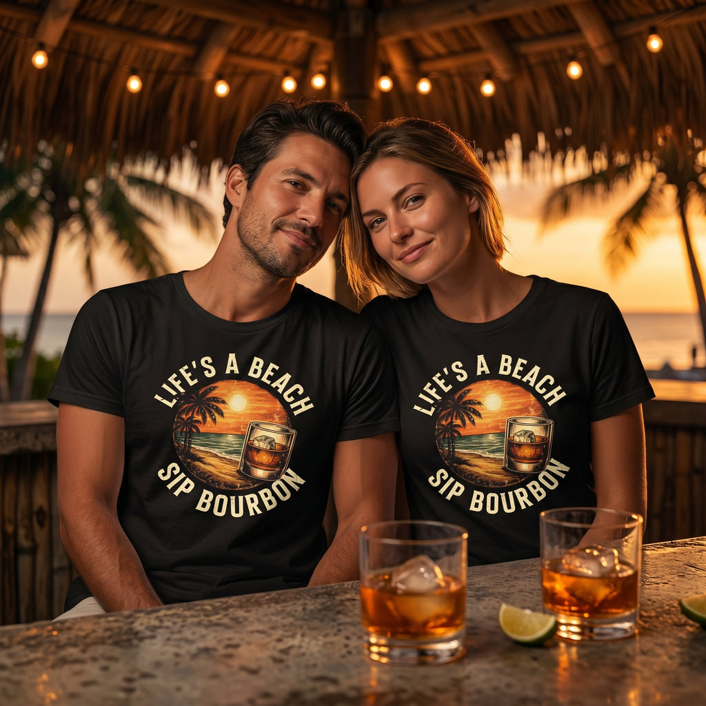 Two people wearing 'Life's a Beach, Sip Bourbon' shirts at a beach bar with drinks.